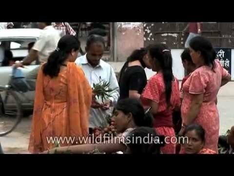 Women shop for litchies in Kathmandu, Nepal