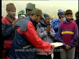 Army soldiers performing prayer before a mountaineering expedition