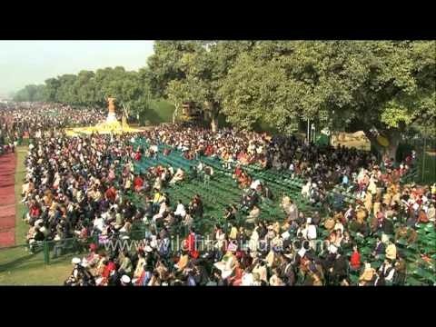 Spectators look on as Indian Army contingent passes by Rajpath in New Delhi