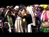 Men performing traditional warrior dance during Kangdali procession