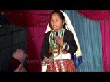 Little girl in traditional Rung attire performing at cultural night in Dharchula