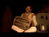 Village percussionist drums for us in a Madhya Pradesh village, at night.