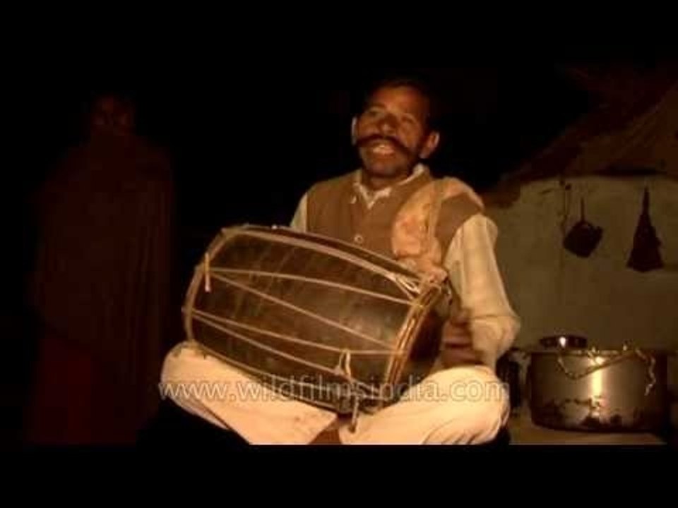 Village percussionist drums for us in a Madhya Pradesh village, at night.