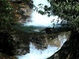 A waterfall gushes ferociously down Kanchenjunga