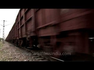 Low angle shot of Indian railway freight train passing by!