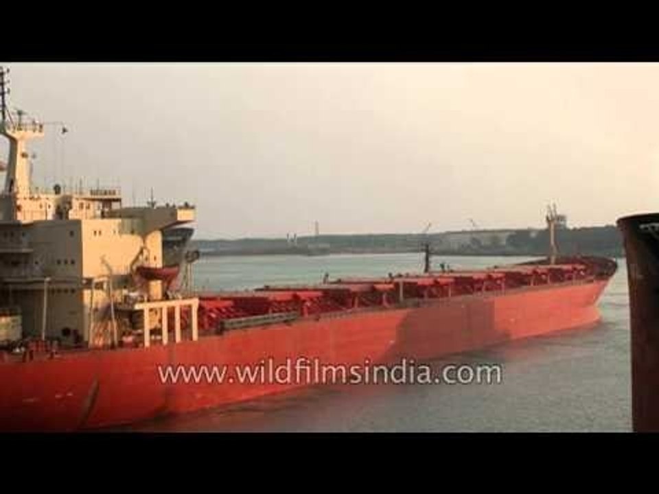 Ship with crane specialized in lifting heavy loads at Paradeep Port