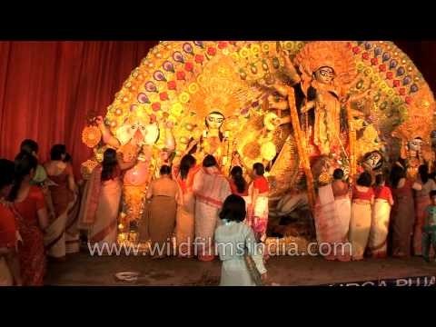 People offering 'Bel Patra' n taking blessings from God on Durga Puja