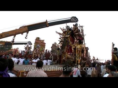 Cranes are being used during Durga Visarjan