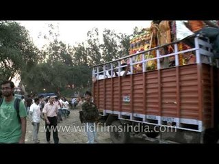 People coming from different places for Durga Visarjan