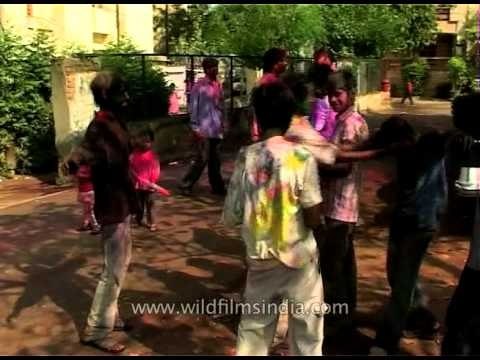 Kids caked with gulal or colored powder on Holi