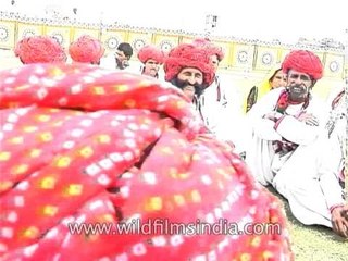 Rajasthani folk artistes smoking bidis