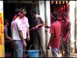 Men will become boys: Smearing each other with coloured powder during Holi