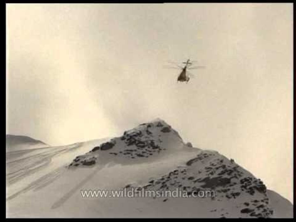 Chopper flying over the Himalayan mountain range