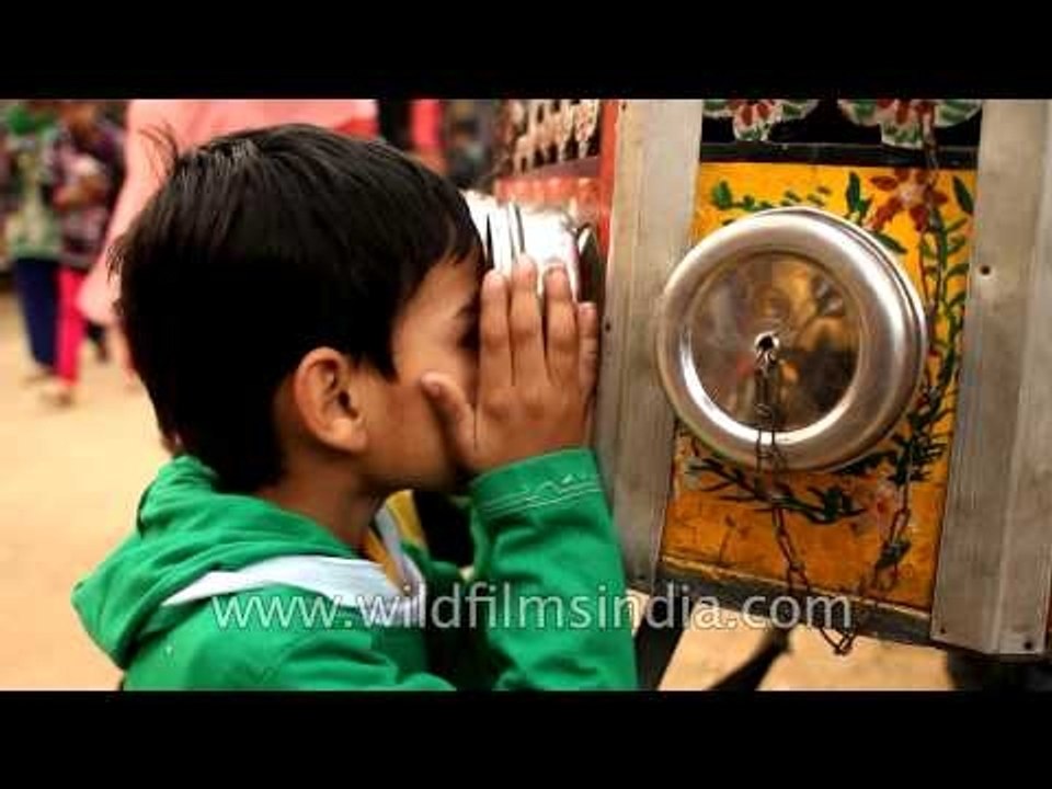 Kids watching short clips through bioscope at Surajkund Mela
