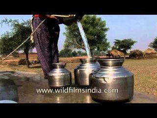 Villagers hauling water out of a bore-well in Uttar Pradesh