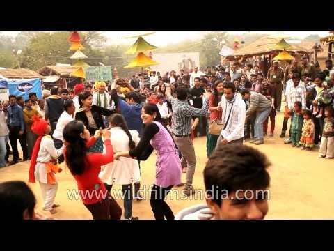 People enjoying 'Been Sapera and Banchari' music form at Surajkund Craft Mela