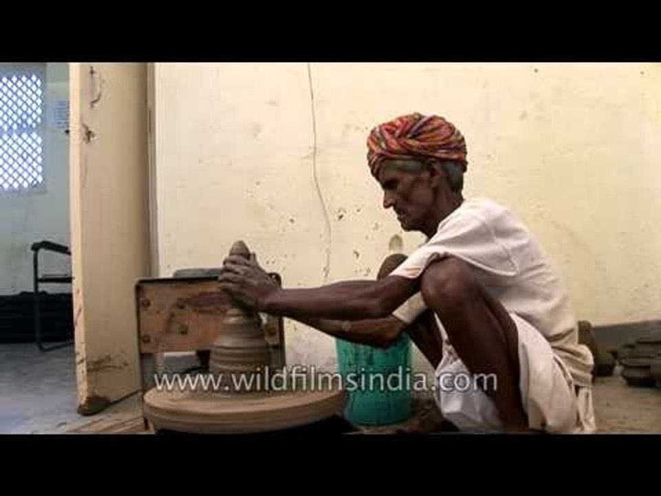 An old potter at work in Uttar Pradesh, India