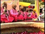 Decorated & well dressed in pink; Snake charmers performing in Dilli Haat