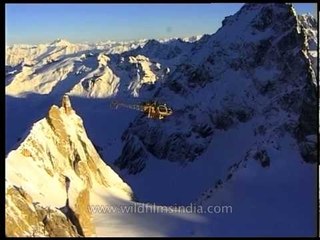 Aerial chopper flying with the snow peak