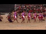 Garo tribal men playing drums while women dance to the beat!