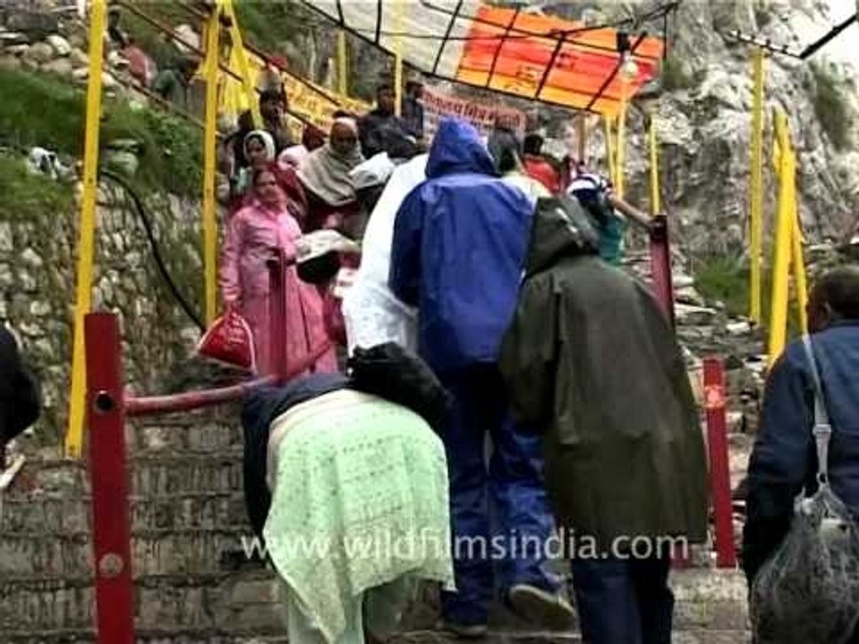 Pilgrims reach up to the Amarnath Holy Shrine