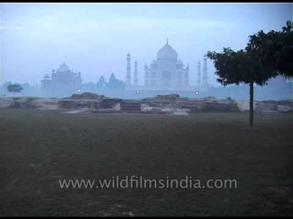 Morning mist over Agra's Taj Mahal mausoleum complex
