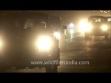 Headlights of passing vehicles at night near Rashtrapati Bhavan, Delhi