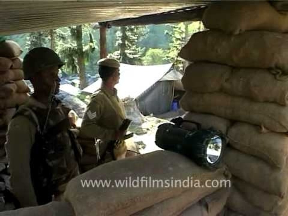 Security forces behind sand bags, at Kashmir check-post