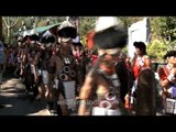 Hornbill Festival folk dancers and singers await the Chief guest's arrival, Nagaland