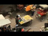 Vehicles squeezing through the small by-lanes of Chandni Chowk, Old Delhi