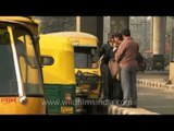 Auto-rickshaws line up outside Govindpuri metro station, Delhi