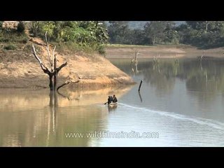 Rowing through Doyang river on a small Boat