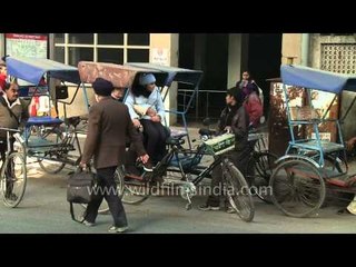 People traveling by rickshaw from Kailash colony Metro