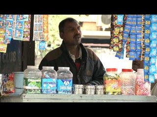 A Paanwala making Paan at a roadside stall