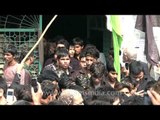 Mourners carry out procession during Muharram