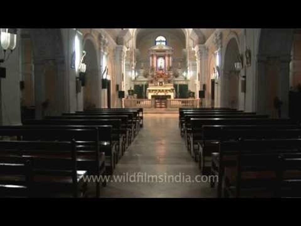Church chairs with kneelers at Basilica of Our Lady Of Graces