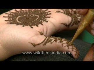 Henna is applied in India, at festival-time!