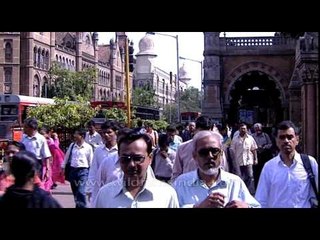 People crossing path right in front of Brihanmumbai Municipal Corporation