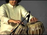 Tabla maestro Ustad Zakir Hussain perform during a concert