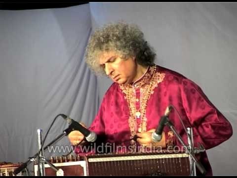 Pandit Shiv Kumar Sharma playing classical instrument at the concert
