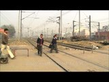Children crossing railway track at Hazrat Nizamuddin Railway Station