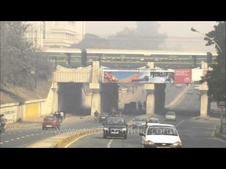 Steam engine train passing over a bridge in Sarojini Nagar, New Delhi