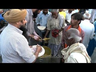 Serving free food to the poor by Jap jaap Sewa