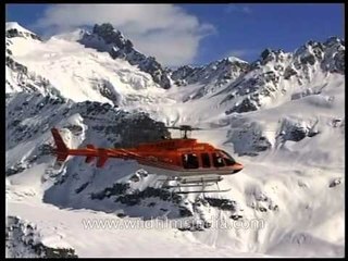 Ascending helicopter over the Himalayan range