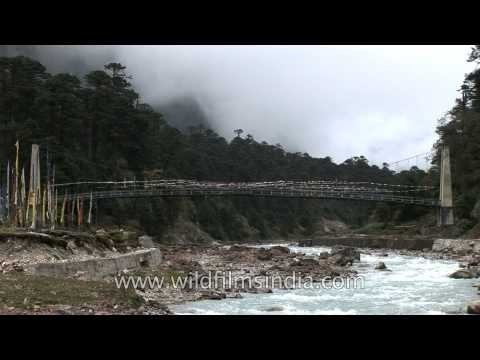 Hanging bridge with prayer flags in Sikkim