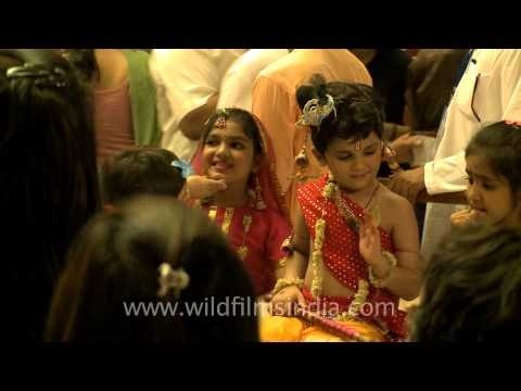 Learning religion early - toddlers dressed as Lord Krishna and Radha