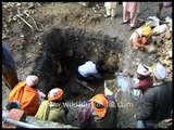 Dead body of a sadhu bleeds during the last rites