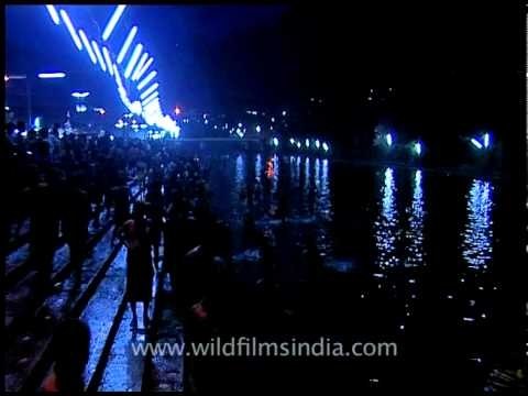Devotees offering big lighting candles to pampa river