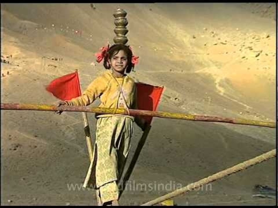 Kid performing dangerous tight rope walk!