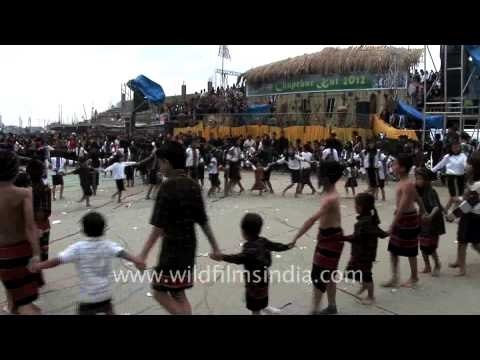Mizo kids singing while holding hands at Chapchar Kut